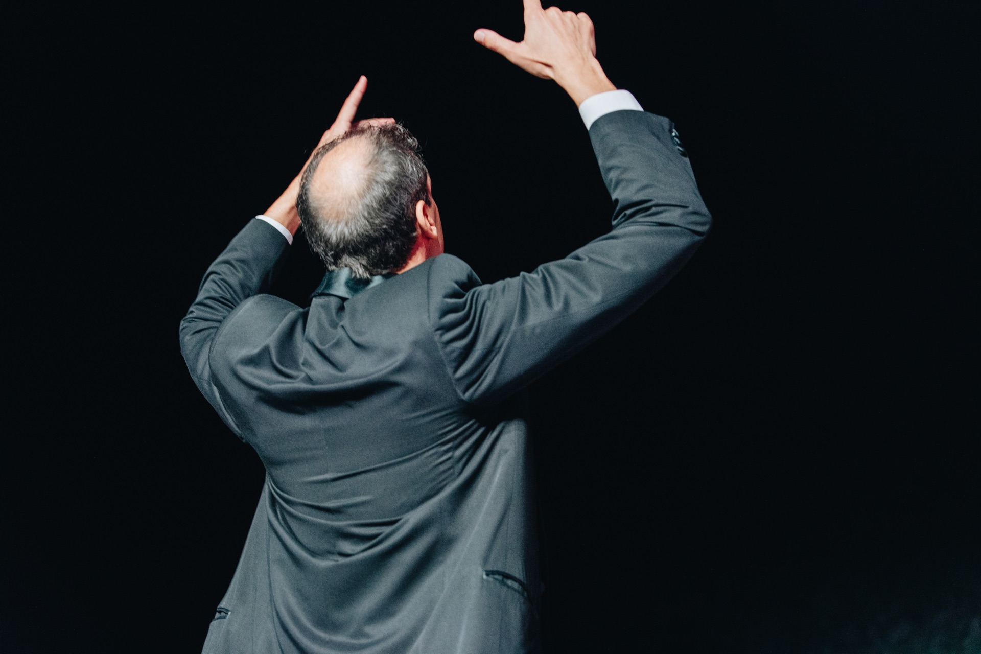 The conductor of Camerata Bulgarica leading the ensemble