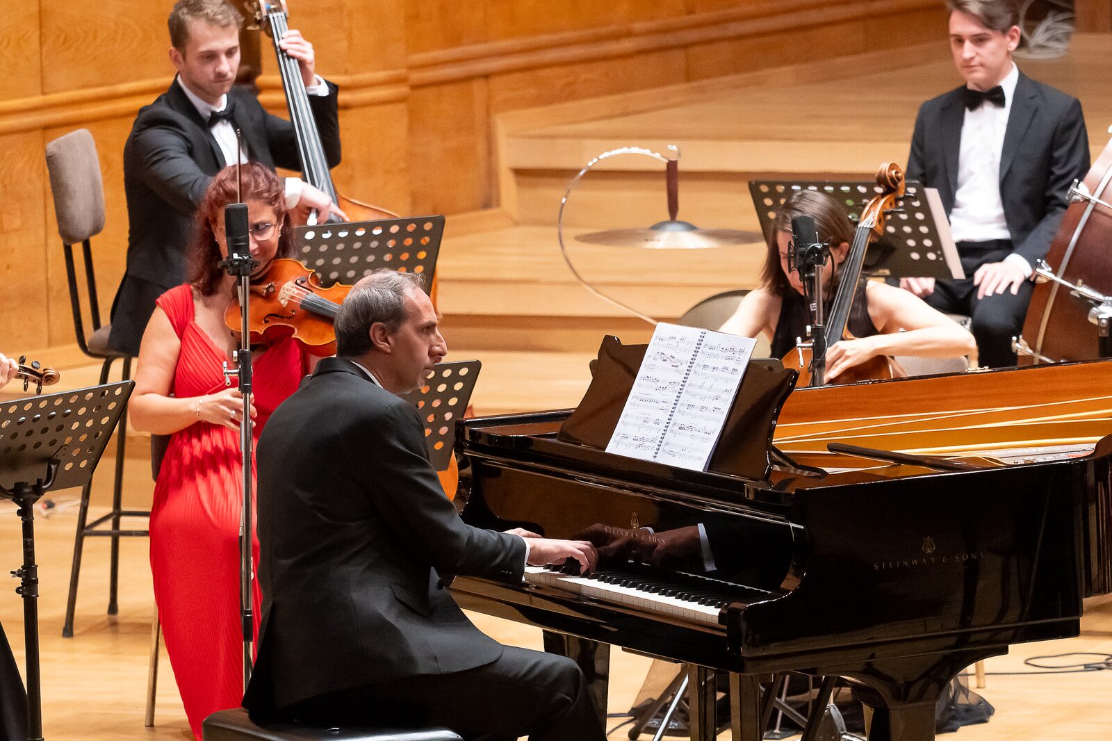 Artistic director Miroslav Georgiev at the piano with the strings of Camerata Bulgarica in Bulgaria Hall
